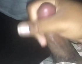 Small black cock jerking off