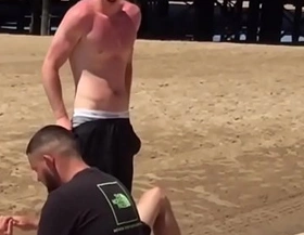 horny shirtless dude adjusts his bulge in front of his friends