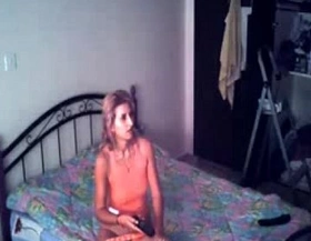 My mom masturbating on bed watching a porno hidden cam